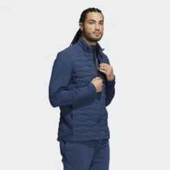 Adidas FROST GUARD JKT NAVY 2021 -Golf Supply Store H50984 on model walking transparent 2000x2000 45c71b08 fae5 461d 846b 640cb8e820bd